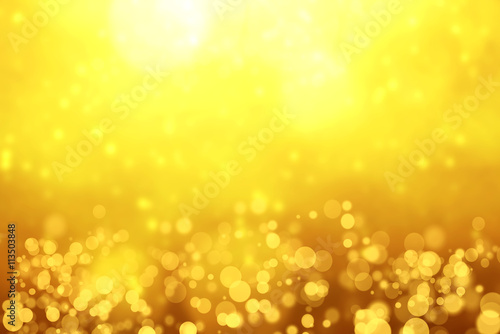 Blurred Golden Bokeh Background with sparkles and glitter.Golden