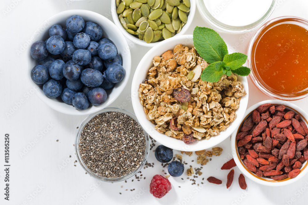 foods for healthy nutrition and fresh berries on white table foods for healthy nutrition and fresh berries on white table