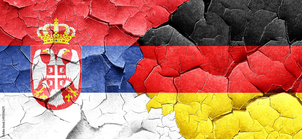 Serbia flag with Germany flag on a grunge cracked wall