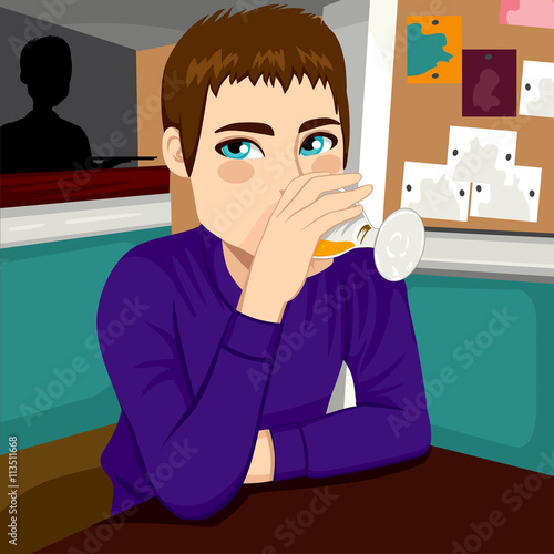 Attractive man drinking col...