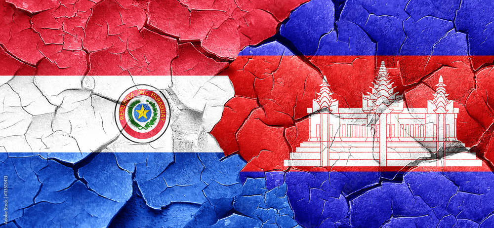 Paraguay flag with Cambodia flag on a grunge cracked wall Paraguay flag with Cambodia flag on a grunge cracked wall