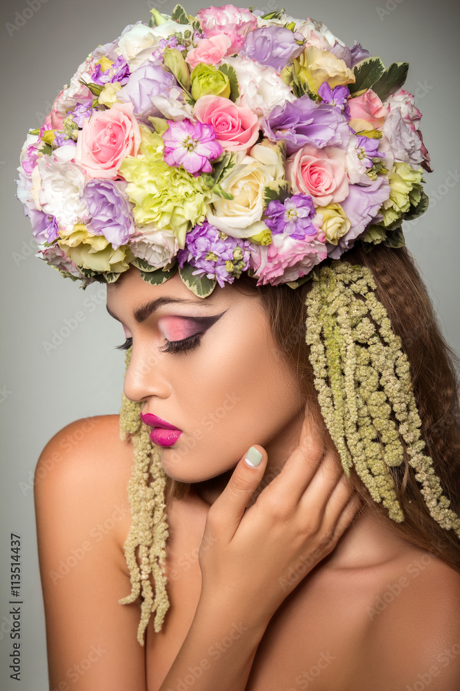Portrait of a girl in a hat of flowers