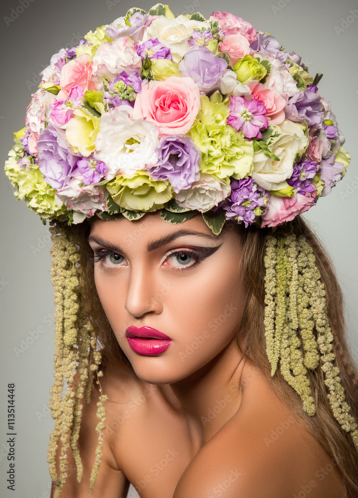 Portrait of a girl in a hat of flowers Portrait of a girl in a hat of flowers