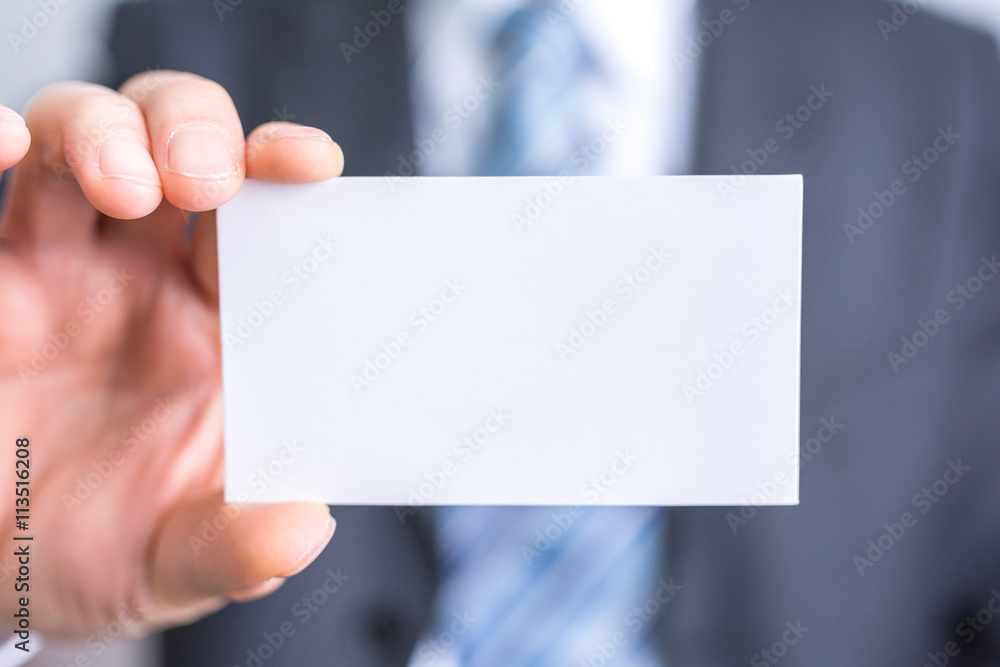 businessman holding white blank paper businessman holding white blank paper