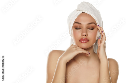 beautiful young woman with a towel on her head 