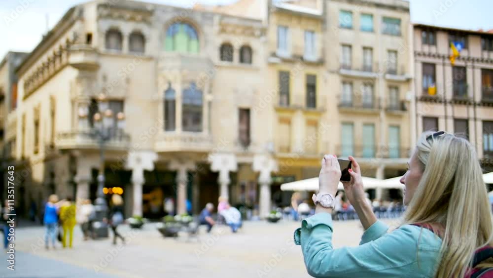 Woman take picture with smartphone. Woman with smartphone taking picture at square on a sunny day Woman take picture with smartphone. Woman with smartphone taking picture at square on a sunny day