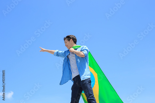 Excited man holding brazil flag © ryanking999