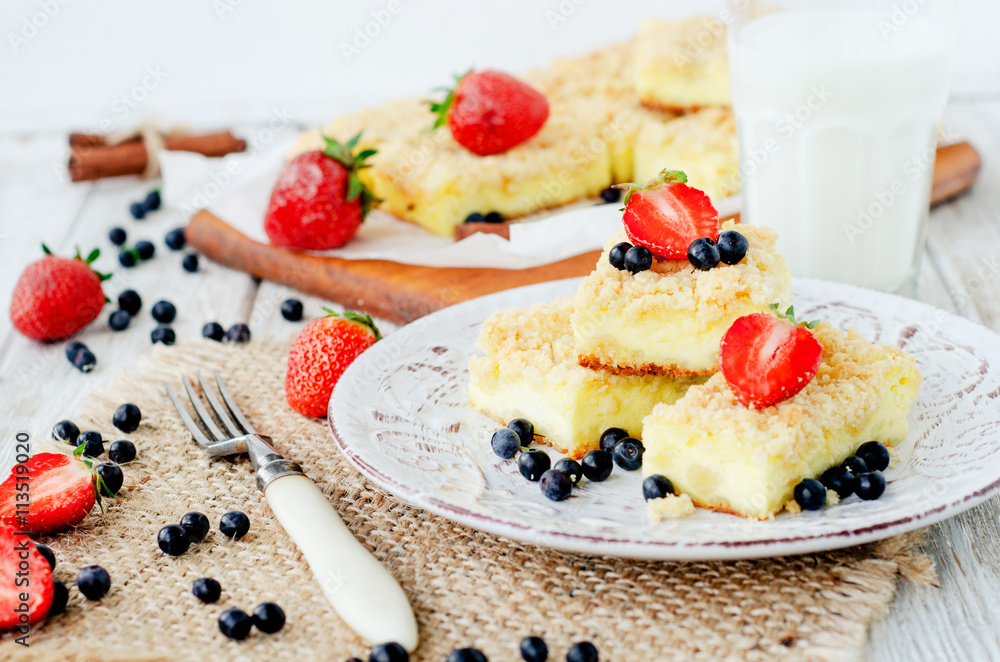 rustic grated cheese cake with berries , with strawberries , blueberries and milk on a wooden background
rustic grated cheese cake with berries , with strawberries , blueberries and milk on a wooden background