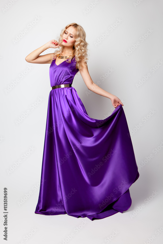 Beautiful woman model posing in violet dress Beautiful woman model posing in violet dress