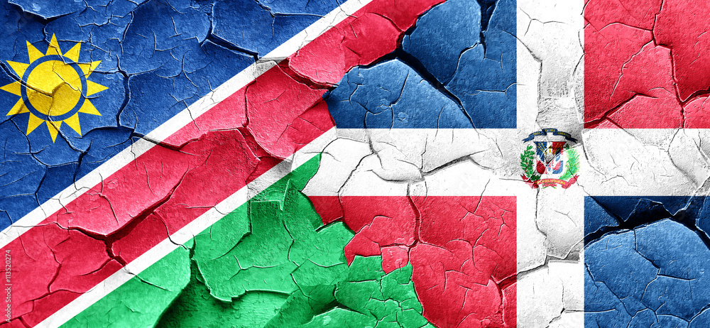 Namibia flag with Dominican Republic flag on a grunge cracked wa Namibia flag with Dominican Republic flag on a grunge cracked wa