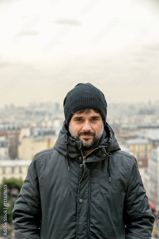 Man wearing a coat and a hut in Paris