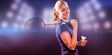 Badminton player holding racket and shuttlecock against composite image of spotlight 
