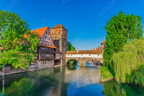 Historical old town of Nuremberg with bridge Weinstadel and Henkerturm tower