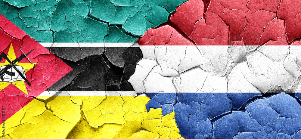 Mozambique flag with Netherlands flag on a grunge cracked wall