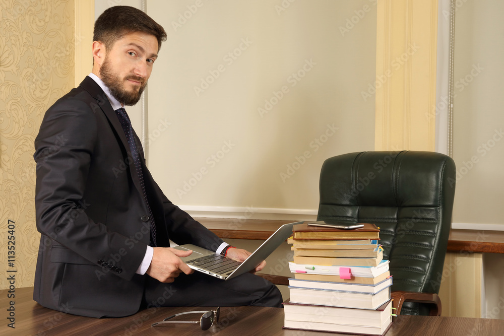 successful business man sitting at office table and working with successful business man sitting at office table and working with