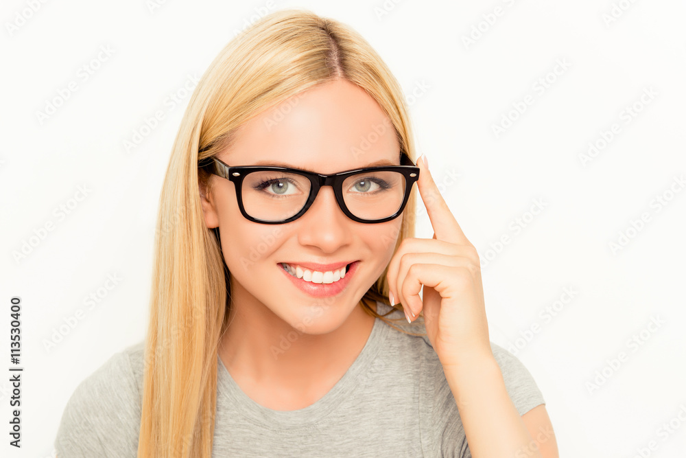 Portrait of beautiful woman with beaming smile wearing glasses