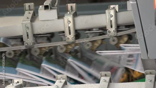 close shot of newspapers in factory industrial prinitng press photo