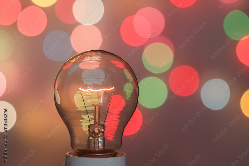 Concept light bulb with a light bokeh background design - obrazy, fototapety, plakaty 