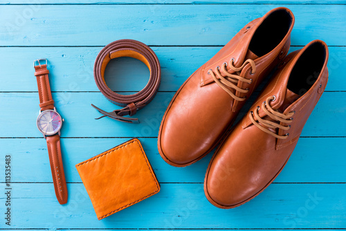Flat lay of men casual fashion on wooden floor