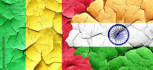 Mali flag with India flag on a grunge cracked wall