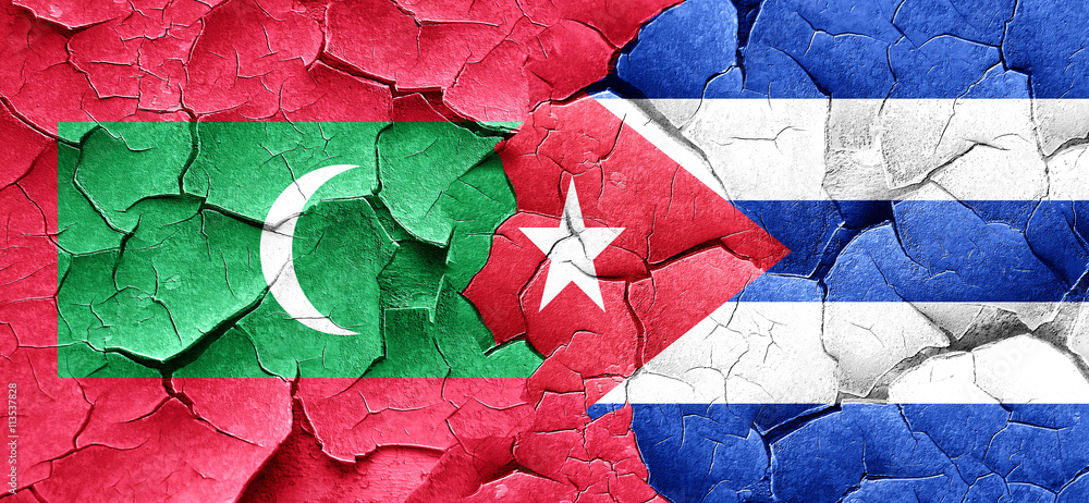 Maldives flag with cuba flag on a grunge cracked wall Maldives flag with cuba flag on a grunge cracked wall