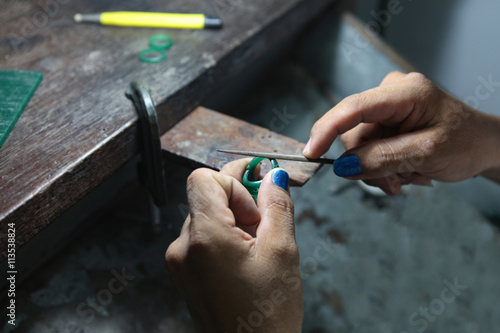 gold smith making a ring' s wax mold, jewelry making photo