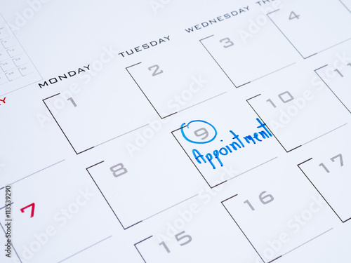 Woman hand write appointment on calendar 2