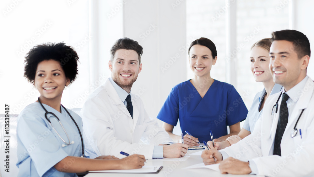 group of happy doctors meeting at hospital office group of happy doctors meeting at hospital office