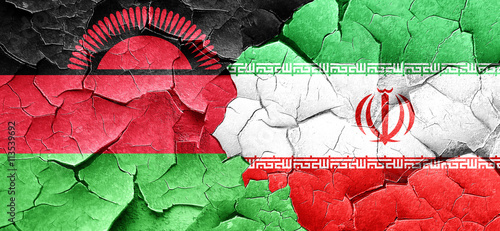 Malawi flag with Iran flag on a grunge cracked wall