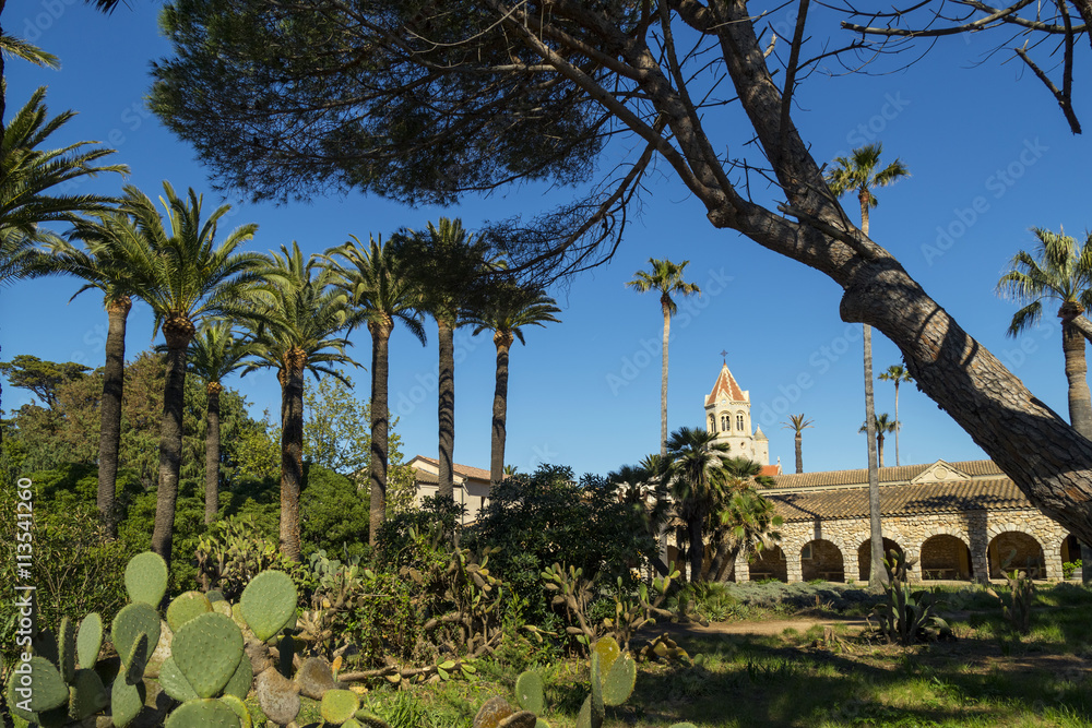 Obraz premium Christianity monastery with garden with palm trees