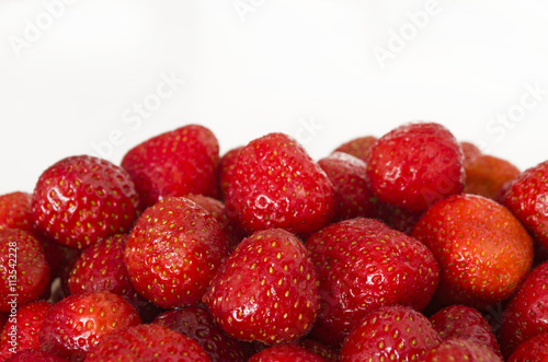 Ripe strawberry with copy space. Summer berries isolated on white background.