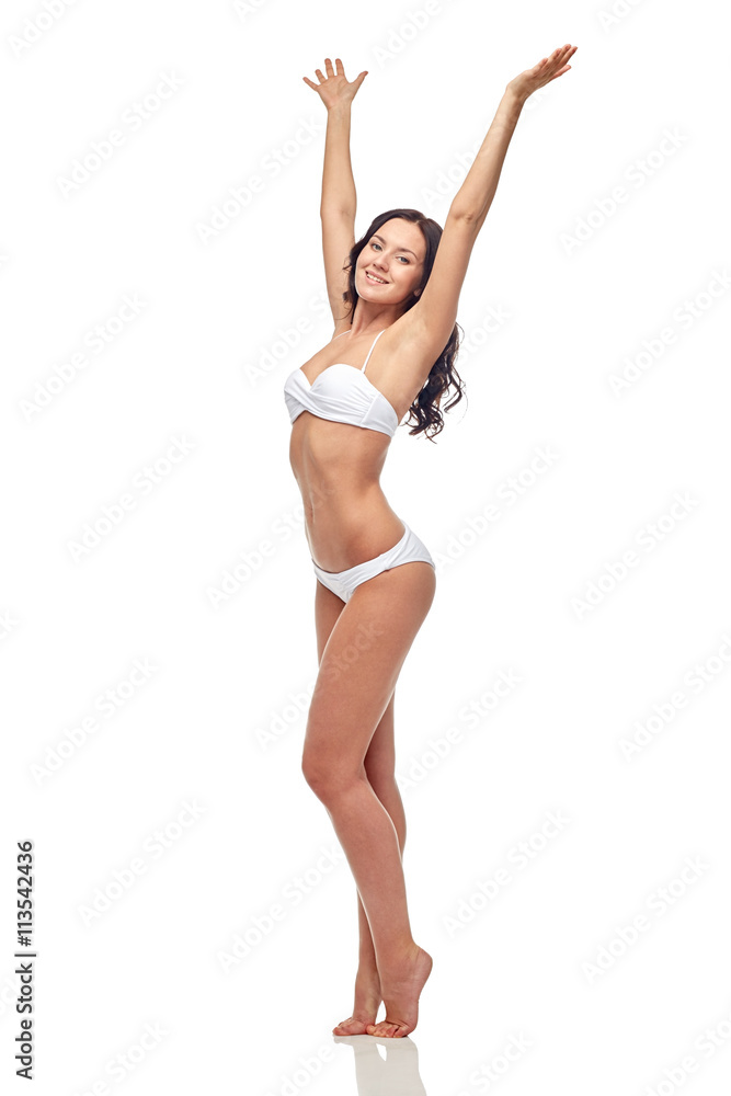 happy young woman in white bikini swimsuit dancing happy young woman in white bikini swimsuit dancing