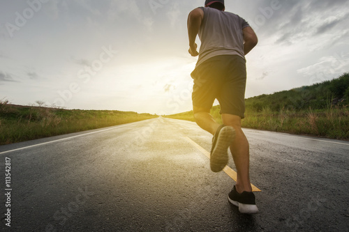sunset and running young man