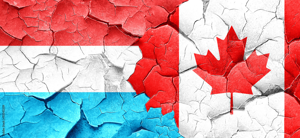 Luxembourg flag with Canada flag on a grunge cracked wall