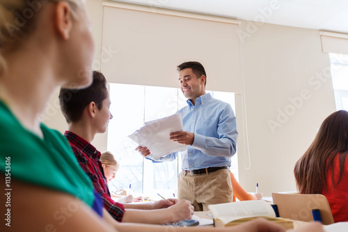 group of students and teacher with test results