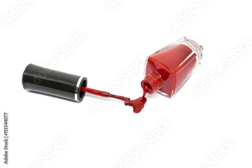 Red nail polish on white background