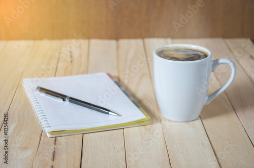 A cup of coffee on the table.