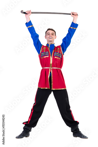 Russian cossack dance. Young dancer posing with sword photo