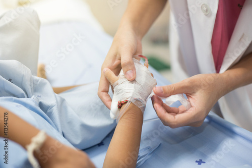 Cropped image of female nurse starting an IV line
