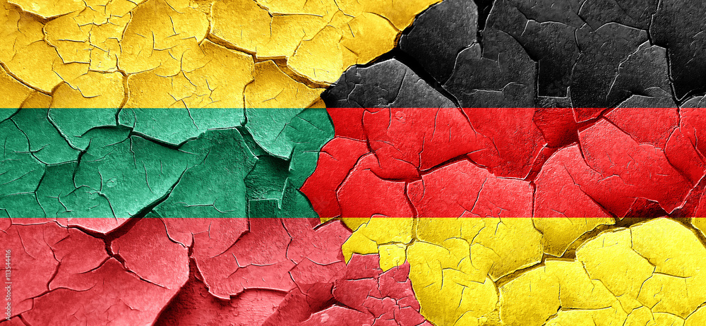 Lithuania flag with Germany flag on a grunge cracked wall
