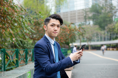 Asian businessman use of cellphone