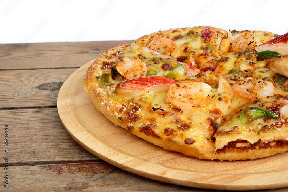 Seafood pizza on a wooden tray