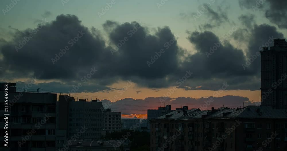 4K Time Lapse, Sunset Above The City. The sun is hidden behind the outskirts of the city houses. On the sky clouds floating anxiety. Made in RAW quality. 4K Time Lapse, Sunset Above The City. The sun is hidden behind the outskirts of the city houses. On the sky clouds floating anxiety. Made in RAW quality.
