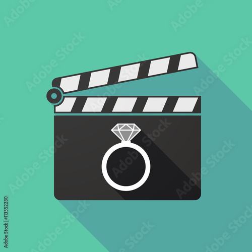 Long shadow clapperboard with an engagement ring