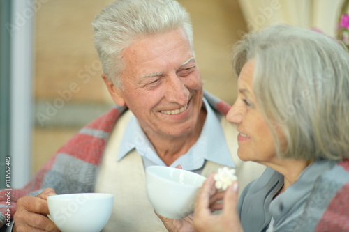 Elderly couple standing  outdoors