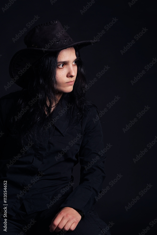 Woman in black shirt and cowboy hat