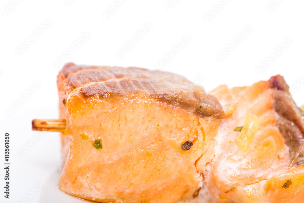 Grilled salmon shish kebab on skewer. Grilled salmon shish kebab on skewer.
