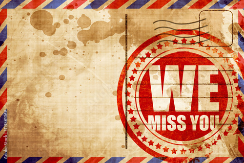 Фотография we miss you, red grunge stamp on an airmail background