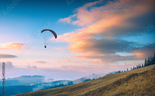 Paraglide in a Carpathian sunset sky