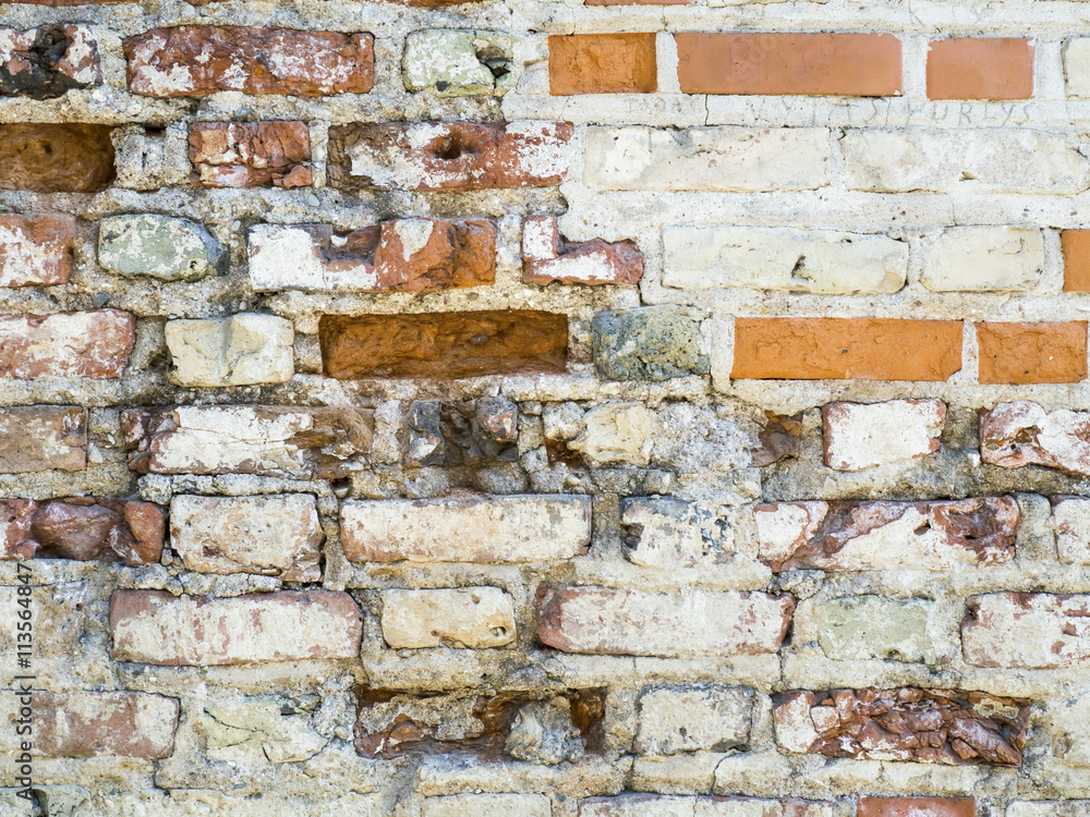 Old red brick wall with sprinkled white plaster texture background